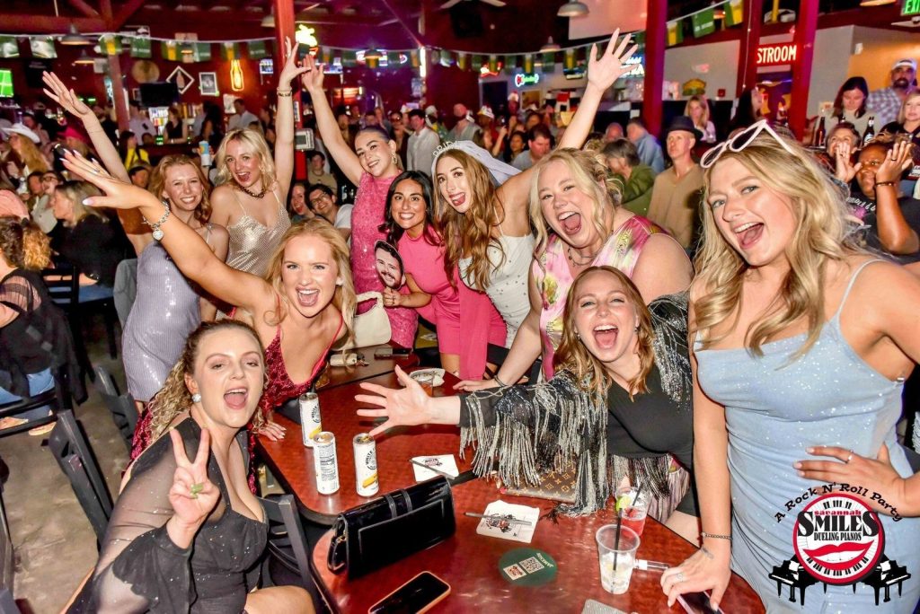 Bachelorette party posing at the front table