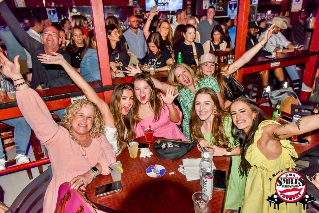 Table of friends cheering during the show