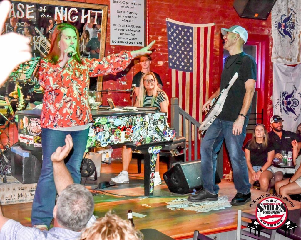 Guest singing with the entertainers on stage