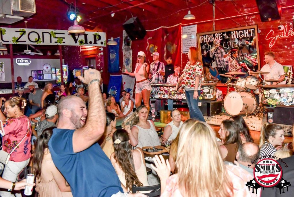 Crowd cheering for the dueling pianos