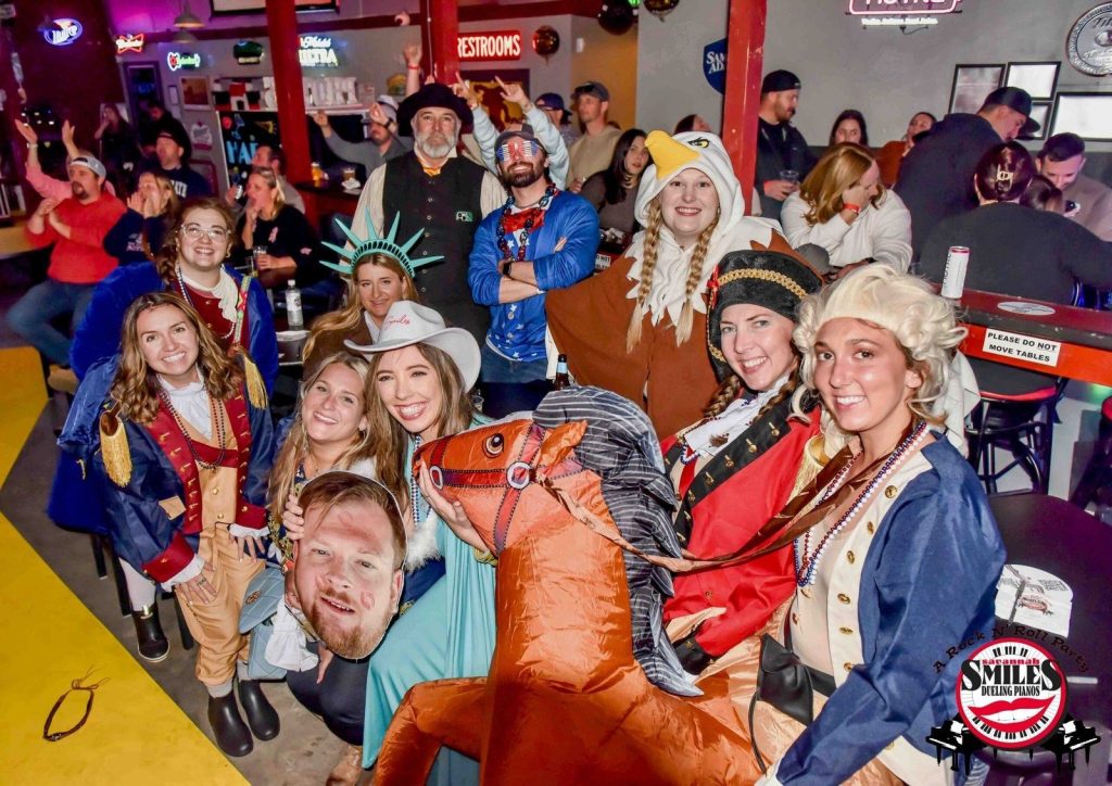 Costumed group posing in the crowd
