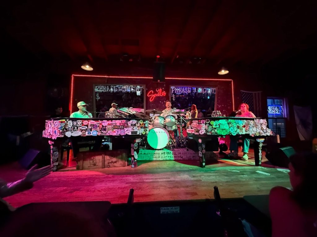 The stage set for a dueling piano show