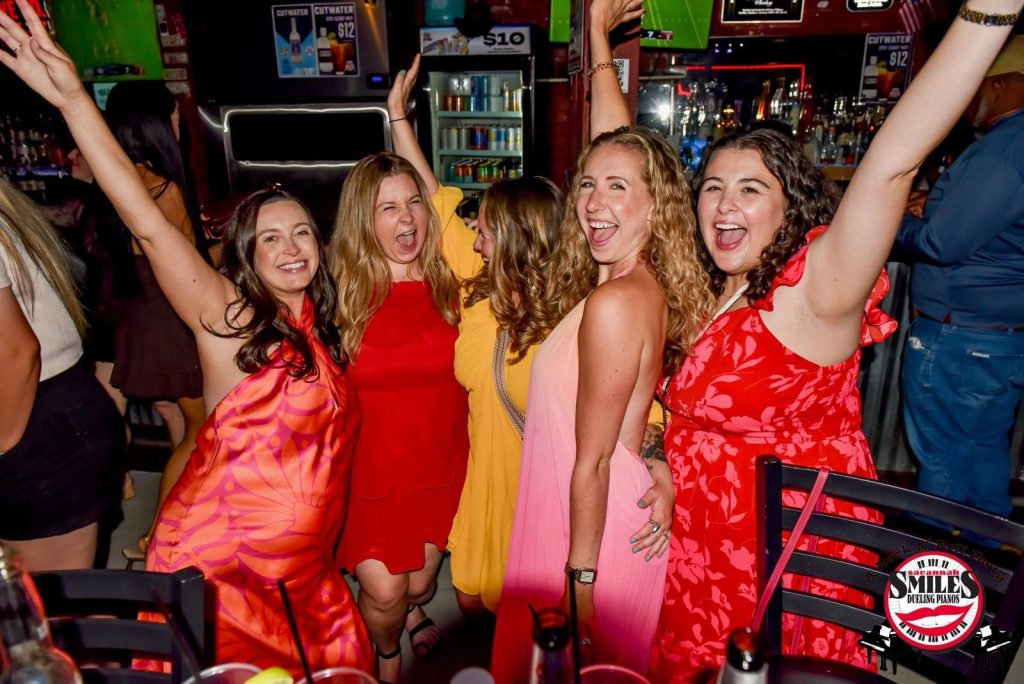 Friends celebrating with hands up