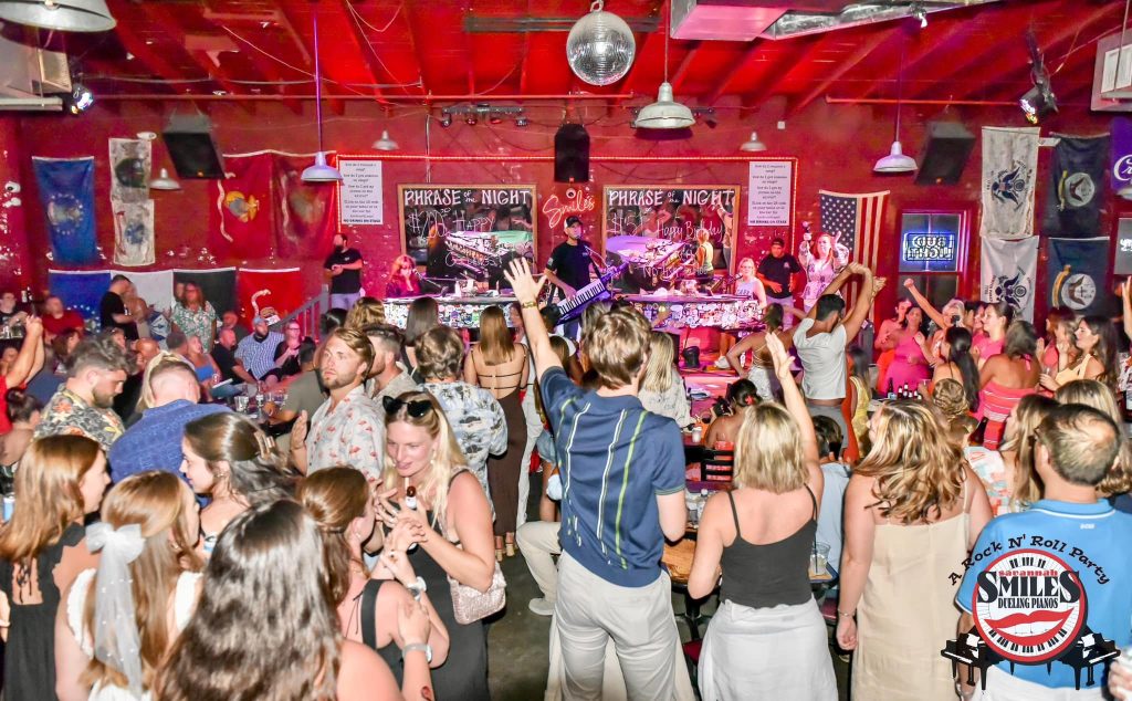 Packed crowd in front of the dueling pianos at Savannah Smiles